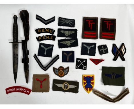 A quantity of badges including WWII and later REME, together with a Fairbairn Sykes 3rd pattern commando dagger in relic cond
