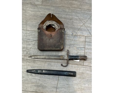 A Turkish bayonet converted into a trench knife, with scabbard. A WWI engineer's coil saw with original leather pouch marked 