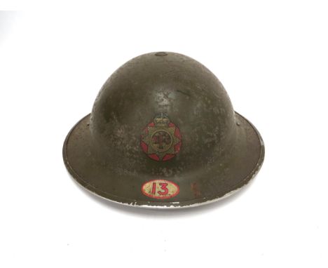 An early WWII British Brodie helmet with National Fire Service (NFS) decal and number 13 denoting Hethersett name etched "EAS