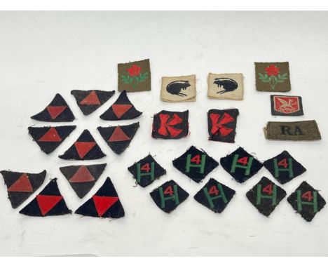 A quantity of British insignia including 3rd Infantry Division patch and 4th Armoured Brigade. From the estate of S/SGT K. WA
