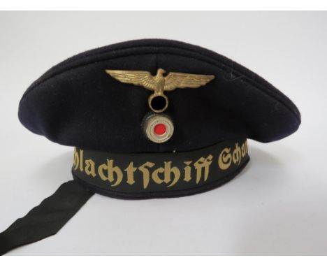A German Kriegsmarine Other Ranks Deck Cap with Scharnhorst cap tally, often referred to as a ‘Donald Duck’ cap. This example