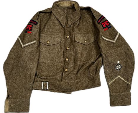 A WWII 1940 pattern Battledress blouse size No.9, WD-O (1942) with Royal Artillery insignia, together with 1942 dated trouser