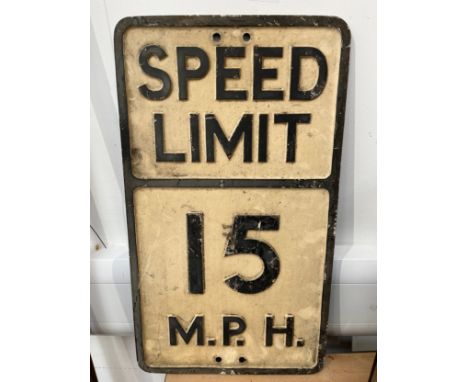 A vintage 'SPEED LIMIT 15 MPH' cast metal sign, thought to be ex military base