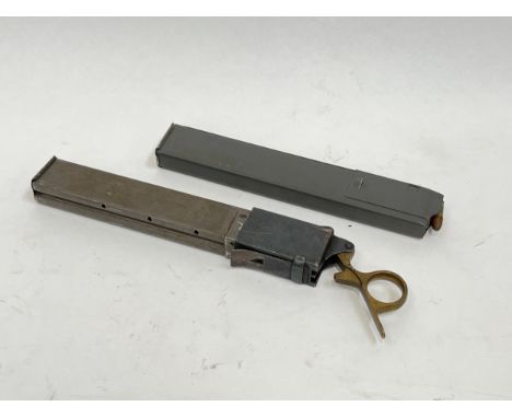 Two Sten gun magazines, one with 9mm rounds (inert) and one loading tool