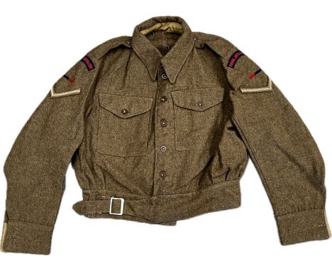 A WWII 1940 pattern Battledress blouse size No.12, dated 1943, with Royal Artillery insignia with 1943 dated trousers (2) Fro