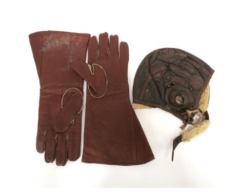 Two lefthanded British leather gauntlets 82c/768 size 9½, 10439/C30(d), together with a US flying helmet (worn)
