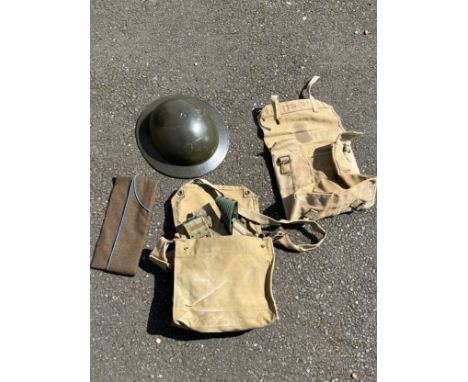 A Belgian Brodie helmet together with backpacks and webbing belts