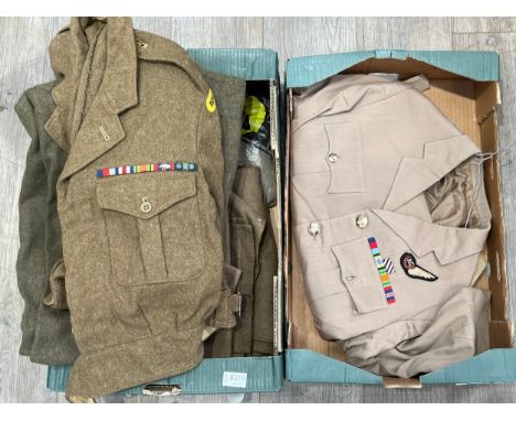 Two boxes of mixed uniform including 1949 pattern battledress blouse dated 1953 with Royal Norfolk Regiment shoulder titles a
