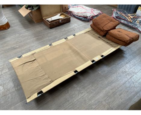 A British camp bed together with WWII pillows