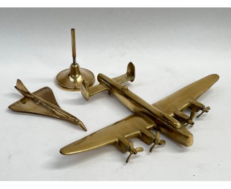 A brass model of a Lancaster and a smaller model of a Concorde, with base a/f
