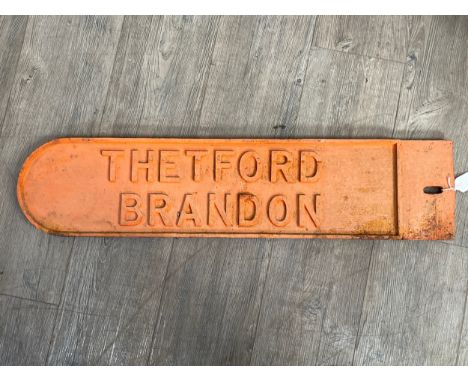 A vintage road sign THETFORD BRANDON, single sided, cast iron painted in orange, possibly wartime, loss to end