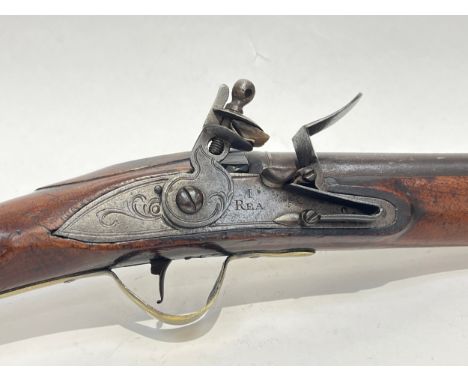 An 18th Century flintlock blunderbuss, signed I. Rea, 10 bore with round 16 1/4in flaring iron barrel banded at the muzzle an
