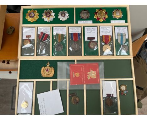 A collection of North Korean medals including Order of the Soldier's Honor, Order of Military Service Honor and Coal mining i