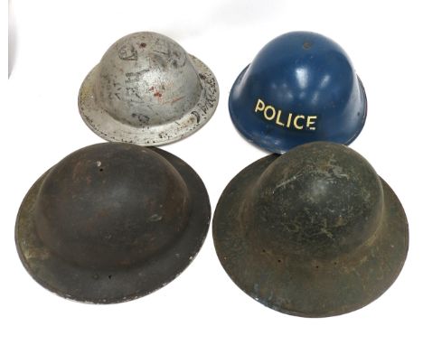 Various helmet shells including Zucherman, together with a later Police helmet (4)