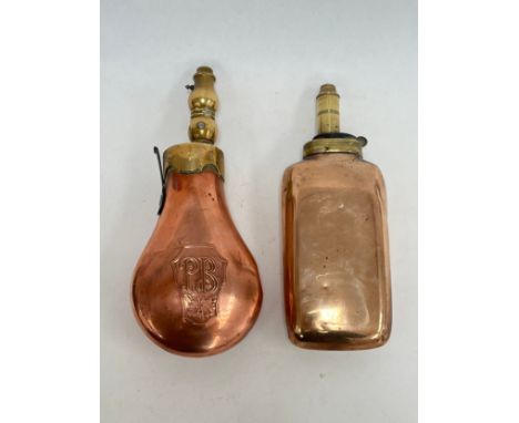 A copper powder flask of rounded oblong form, together with another with PB initials and foliate design (2)