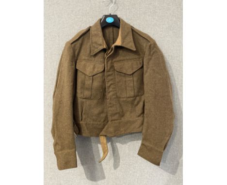 A WWII 1940 pattern battledress blouse, size no. 4, dated 13 Jul 1942 to date stamp, no obvious signs of moth