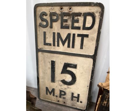A vintage 'SPEED LIMIT 15 MPH' cast metal sign, thought to be ex military base
