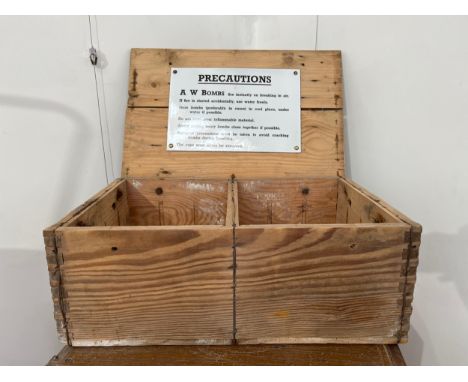 A WWII A.W. Bombs (incendiary) pine case with original enamel sign to inside of lid