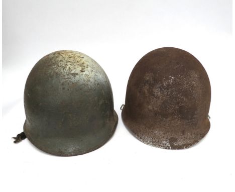 A post war US helmet with liner, together with a US helmet shell (2)