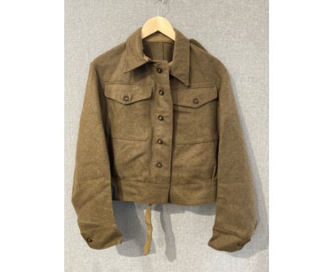 A WWII British battledress blouse, 1940 pattern, size no. 13, Henry Freedman Ltd., dated April 1943