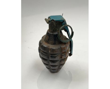 A British pineapple training grenade, inert