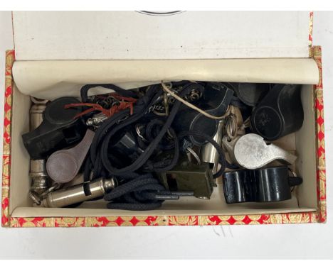 A collection of whistles including 'The Metropolitan' with broad arrow mark, and 1945 dated