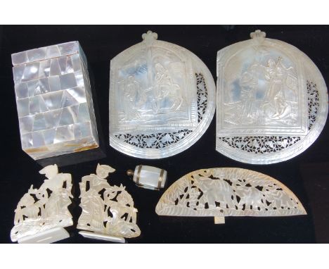 Two late 19th century Jerusalem carved mother of pearl shells, each depicting religious scenes; together with various other 1