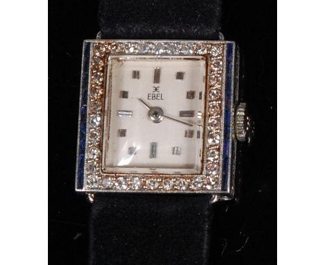 A ladies Ebel Art Deco platinum cocktail watch, the signed square dial with baton markers, within a surround of small brillia