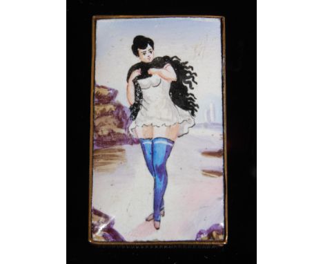 A circa 1900 French brass vesta case, of rectangular form, the hinged lid enamel decorated with a corset-clad lady within a l