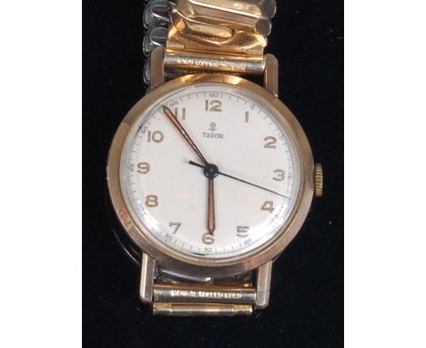 A gents 9ct gold cased Tudor Rolex wristwatch, having a signed silvered dial, with luminous Arabic numerals, manual wind 15-j