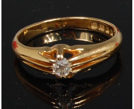 An 18ct gold diamond solitaire ring, the eight claw set brilliant weighing approx 0.2ct, size R