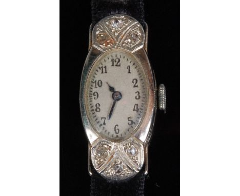 A ladies circa 1920 18ct white gold diamond set cocktail watch, the unsigned silver dial with Arabic numerals and flanked top