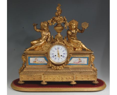 A Robin of Paris - mid-19th century French gilt brass mantel clock, the signed white enamel dial with Roman numerals, having 