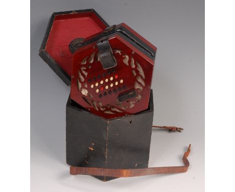 A rosewood 48 button concertina by Lachenal & Co, numbered 59247, fabric with pierced rosewood hexagonal ends, coloured bone 