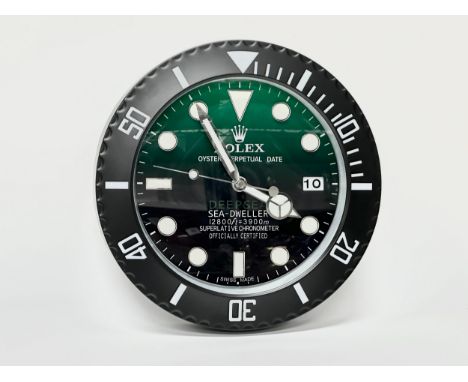 A Rolex Oyster Perpetual Date Deepsea Sea-Dealer wall clock. 34cm