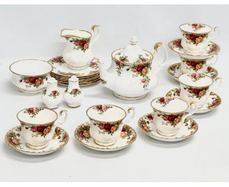 Royal Albert “Old Country Roses” A 23 piece tea service. A 1962 Royal Albert LTD teapot. Salt and pepper shakers.