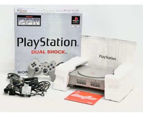 A Sony PlayStation Dual Shock. With box, controller, cables and memory card.