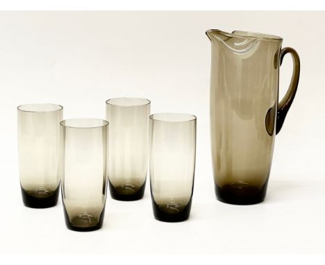 A 1960’s Mid Century smoked glass drinks set. Pitcher 25cm, 4 matching glasses 14cm