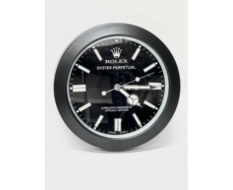 A Rolex Oyster Perpetual wall clock. 34cm