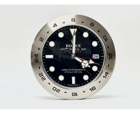 A Rolex Oyster Perpetual Date Explorer II wall clock. 34cm