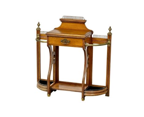 A good quality Late 19th Century Victorian oak umbrella stand/stickstand, with polished brass rails, finials and gallery. Bri