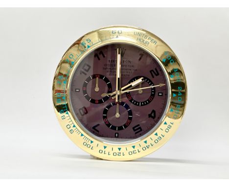A Rolex Oyster Perpetual Daytona wall clock. 34cm