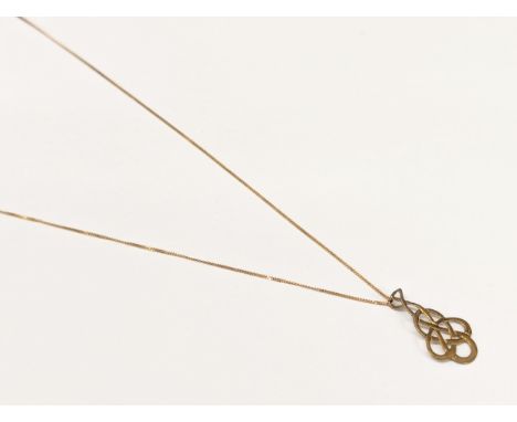 A 9ct gold Celtic pendant on chain. Total weight 1.09g