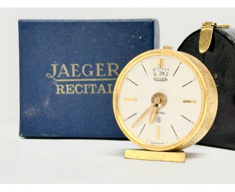 Jaeger-LeCoultre Recital. A Mid 20th Century gilt brass 8 day travel alarm clock with case, box and papers.