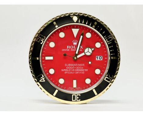 A Rolex Oyster Perpetual Date Submariner wall clock. 34cm