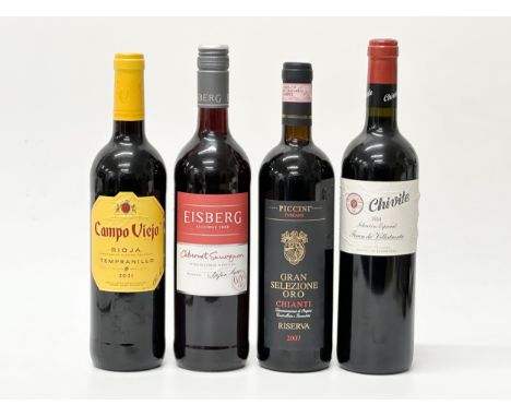 Four bottles of red wine. Gran Selezione Oro Chianti 2007. Chivite 2014. Eisberg. Campo Viejo.