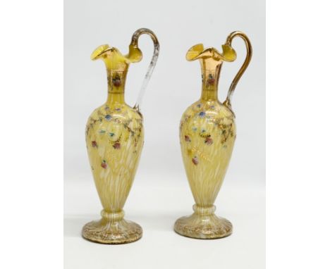 A pair of tall Late 19th Century Bohemian hand painted enamel splatter glass ewer style vases. 30.5cm