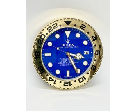 A Rolex Oyster Perpetual Date Submariner wall clock. 34cm