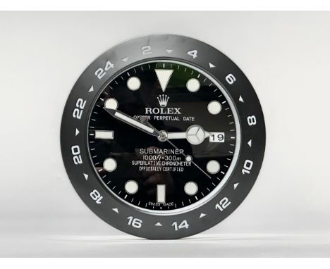 A Rolex Oyster Perpetual Date Submariner wall clock. 34cm