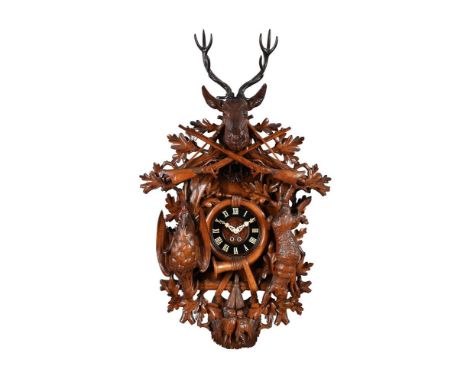 A FINE BLACK FOREST CARVED LIMEWOOD SPRING-DRIVEN CUCKOO WALL CLOCKALEXANDER FLEIG, TRIBERG, LATE 19th CENTURYThe twin going 